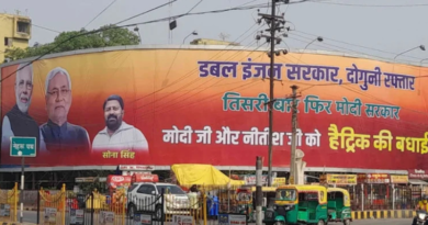 A JDU supporter placed poster of Nitish Kumar and Narendra Modi in Patna.